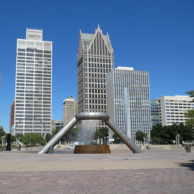 The Horace E. Dodge Fountain: a stainless steel sculpture of a ring suspended and supported by two metal beams in Hart Plaza